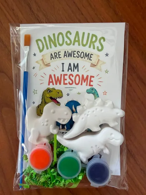 Dinosaur plaster paint kit with bright paints, a brush and a dinosaur message card