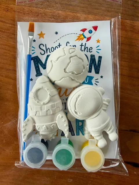 Space kit with plaster astronaut, rocket and planets, paint pots and a brush