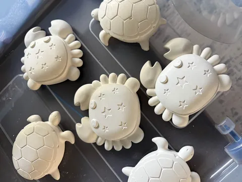 Freshly made white plaster crabs, turtles and ocean friends, ready to paint